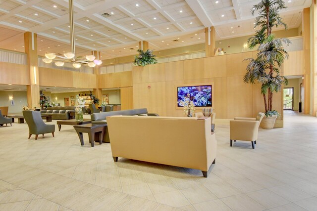 basement with light tile patterned floors and a drop ceiling