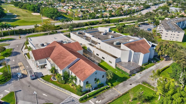 drone / aerial view featuring a residential view and golf course view