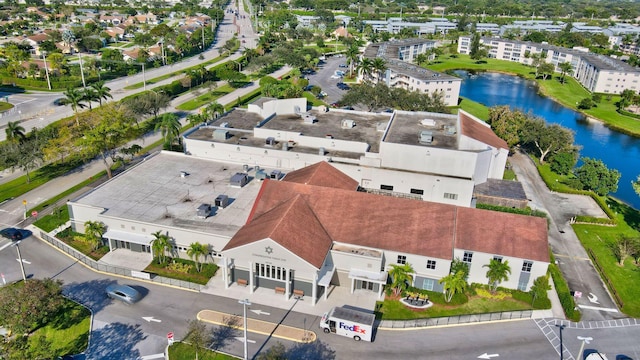 birds eye view of property featuring a water view and a residential view