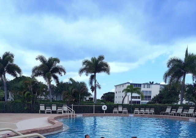 community pool featuring fence