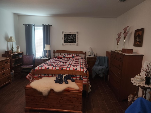 bedroom featuring dark wood-type flooring