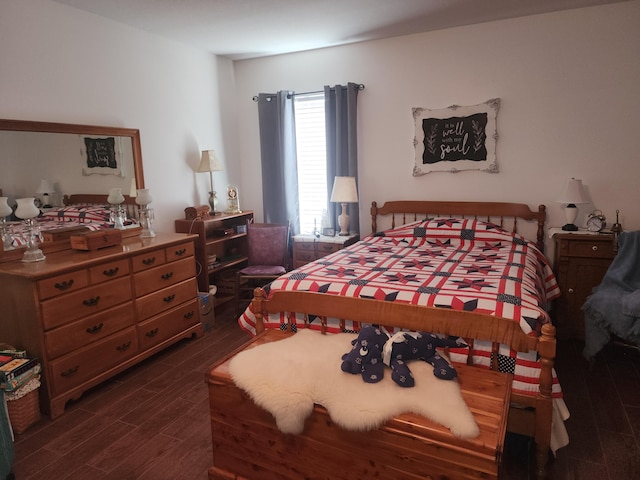 bedroom with dark wood-type flooring