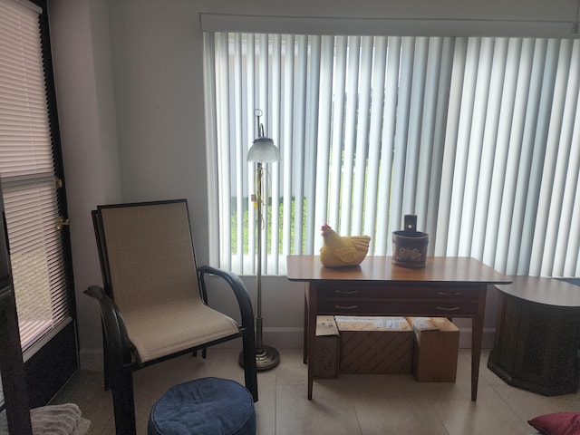 sitting room with light tile patterned flooring