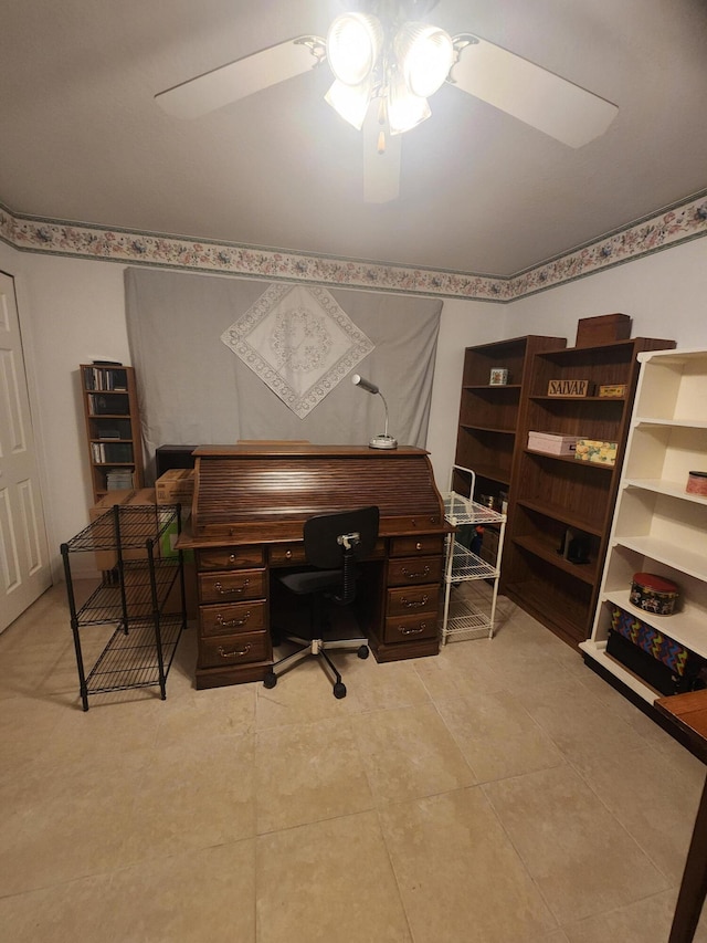 tiled office space featuring ceiling fan