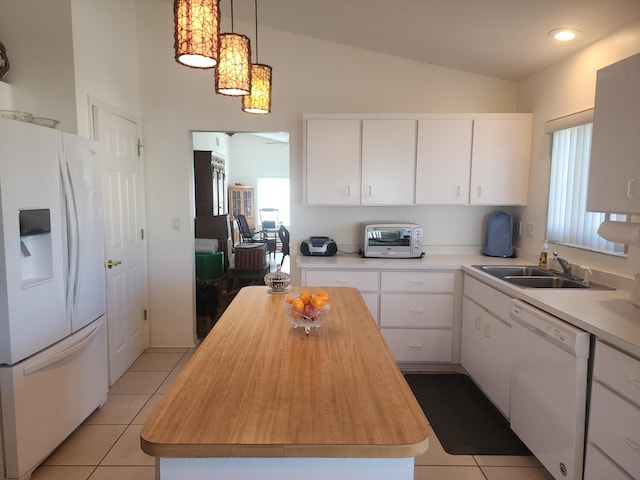 kitchen featuring a center island, white cabinetry, white appliances, and hanging light fixtures