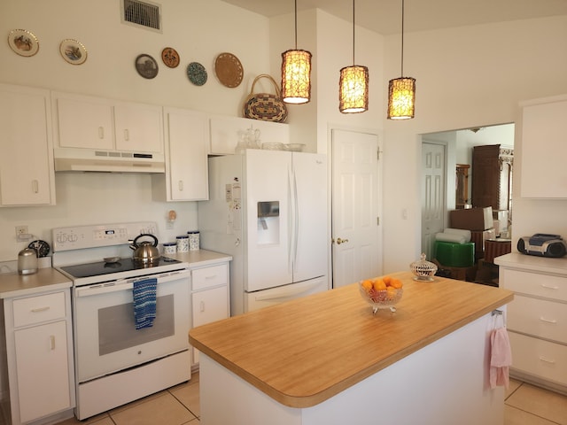 kitchen with pendant lighting, light tile patterned flooring, white appliances, white cabinets, and a kitchen island