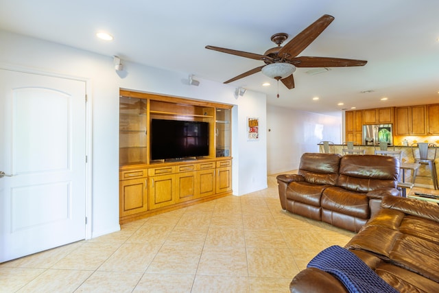 living area featuring ceiling fan, recessed lighting, and light tile patterned floors
