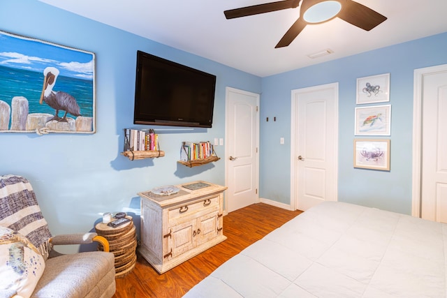 bedroom with wood finished floors and ceiling fan