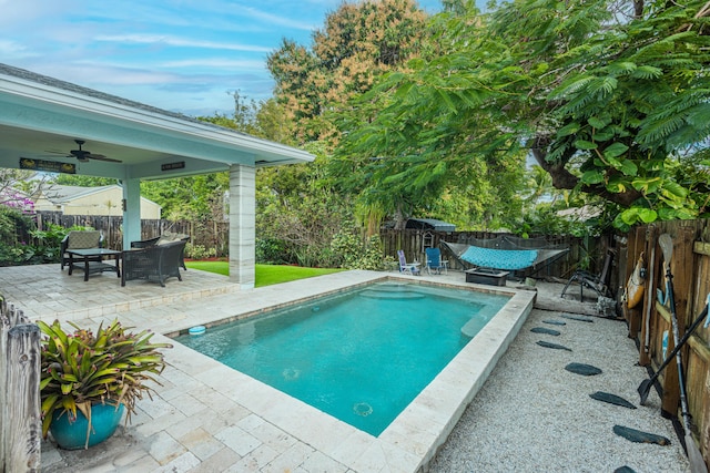 view of pool featuring a patio and ceiling fan