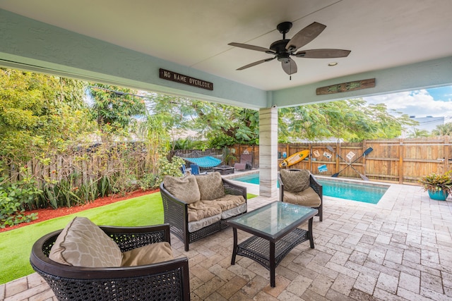 view of patio with a fenced backyard, a ceiling fan, and outdoor lounge area