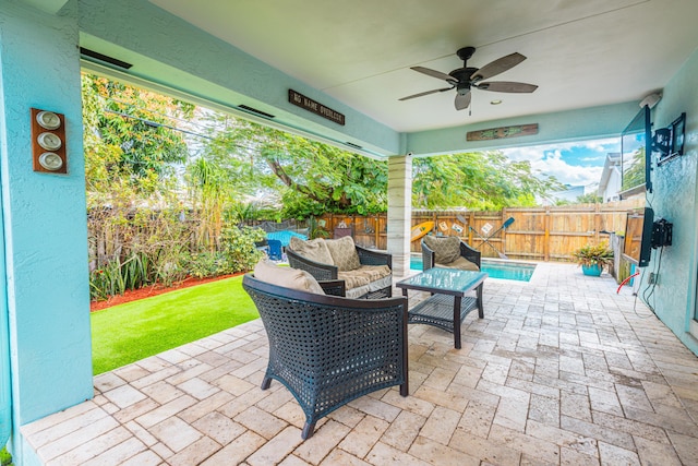 view of patio / terrace featuring an outdoor living space and ceiling fan