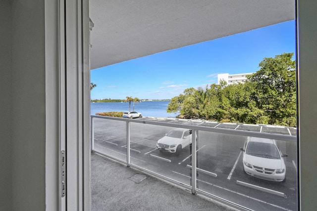 balcony featuring a water view