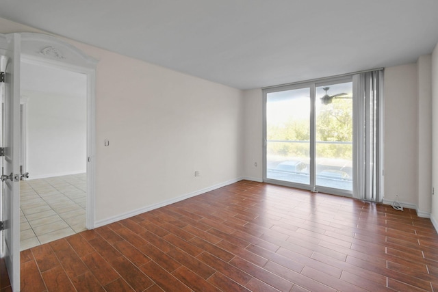 spare room with floor to ceiling windows