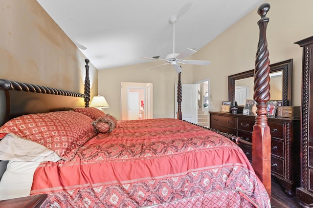 bedroom with vaulted ceiling, ceiling fan, connected bathroom, and hardwood / wood-style flooring