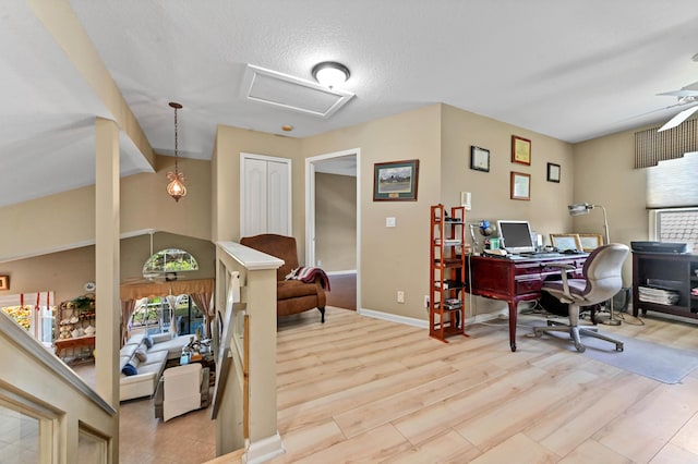 office with ceiling fan, a textured ceiling, and light hardwood / wood-style flooring