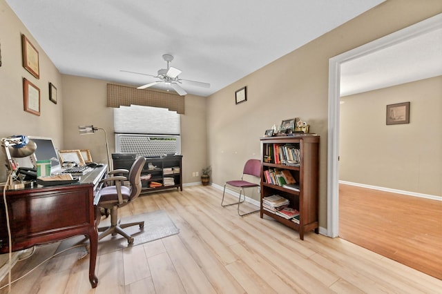 office space featuring ceiling fan and light hardwood / wood-style flooring