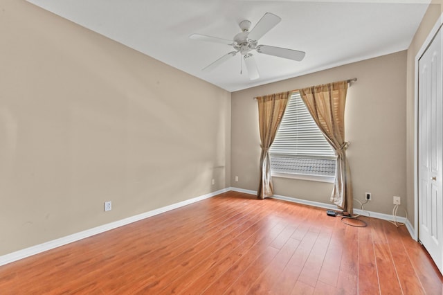 empty room featuring ceiling fan and wood-type flooring