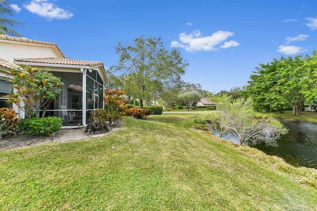 view of yard featuring a sunroom