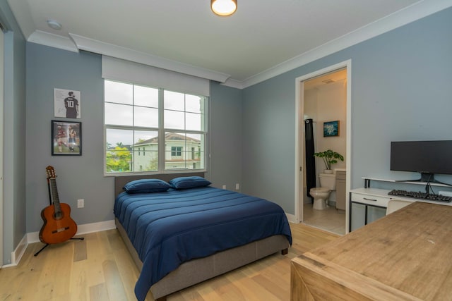 bedroom featuring light hardwood / wood-style floors, connected bathroom, and crown molding