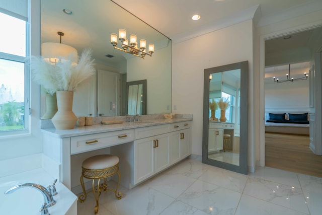 bathroom featuring vanity, a bathtub, plenty of natural light, and crown molding