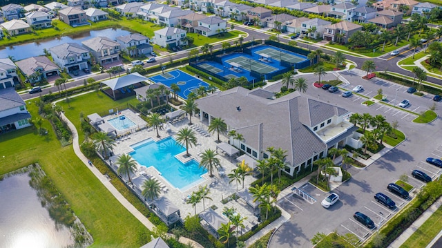 birds eye view of property featuring a water view