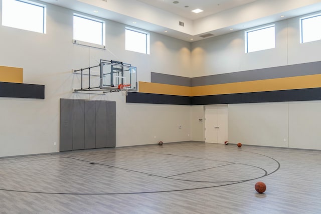 view of basketball court featuring a wealth of natural light