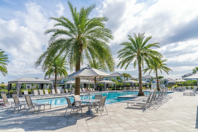 view of swimming pool featuring a gazebo and a patio