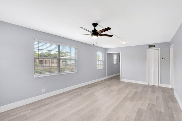 unfurnished room with ceiling fan and light hardwood / wood-style flooring