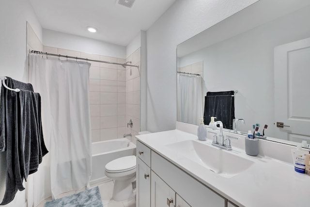 full bathroom featuring toilet, tile patterned floors, shower / tub combo with curtain, and vanity