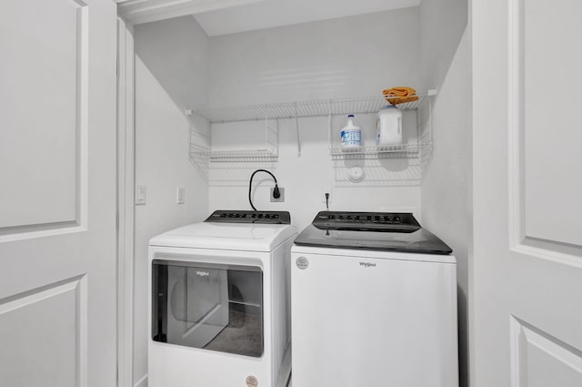 clothes washing area featuring washing machine and clothes dryer