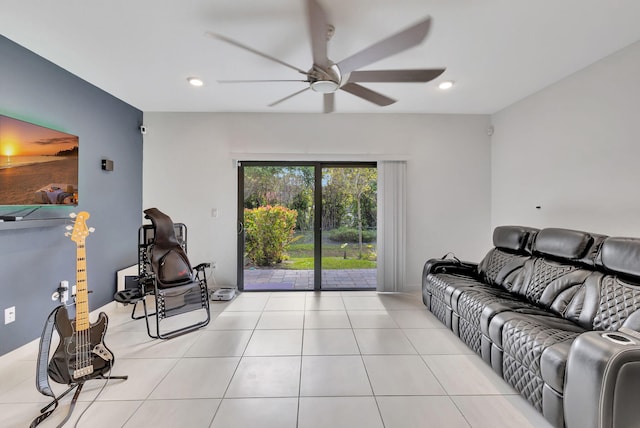 living room featuring light tile patterned flooring and ceiling fan