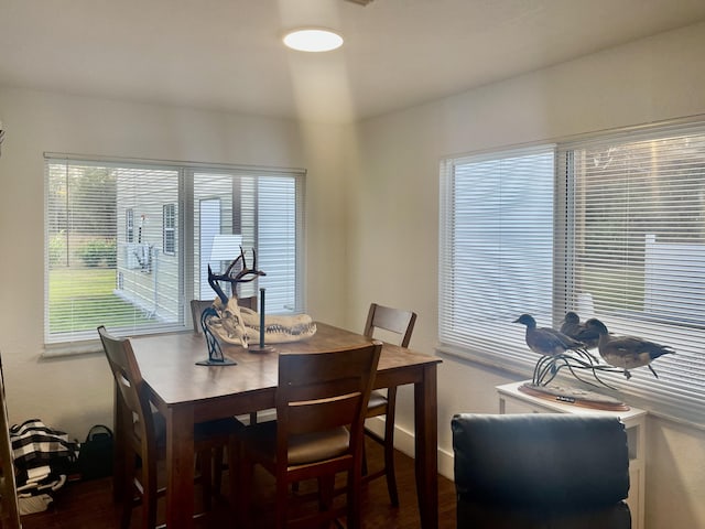 dining area featuring dark hardwood / wood-style flooring