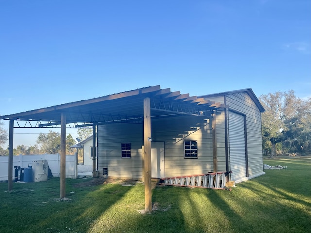 view of side of property with a yard