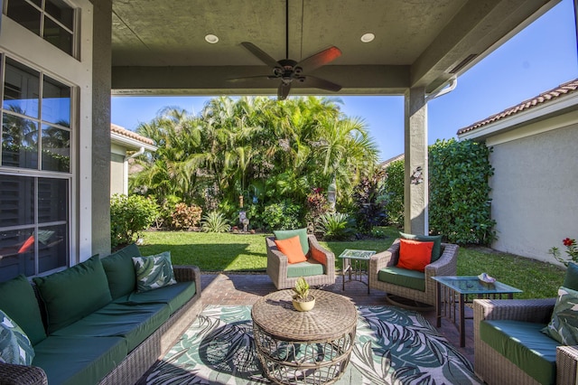 view of patio with ceiling fan and outdoor lounge area