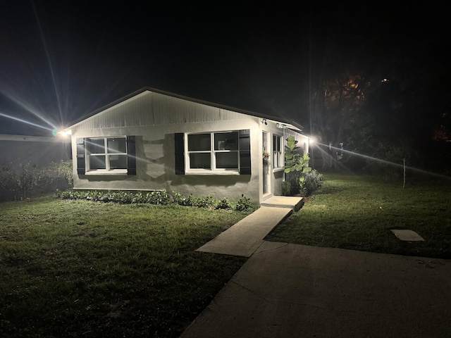 view of front of house with a lawn