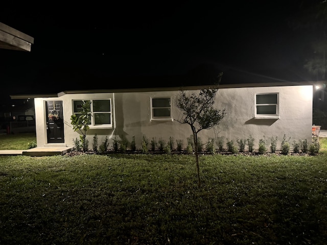 view of front of house with a lawn