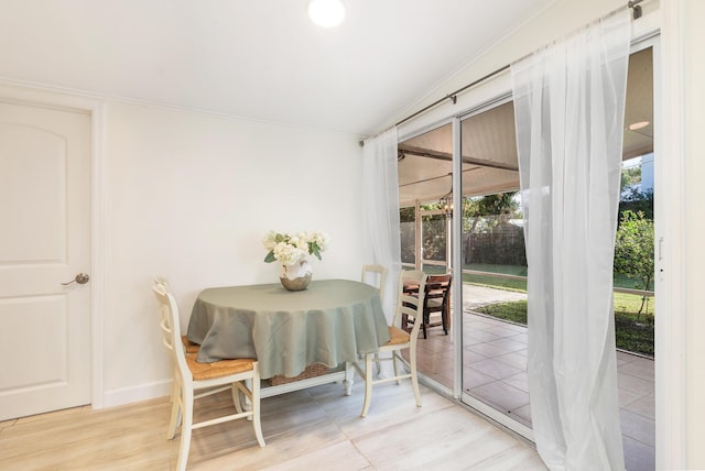 dining space featuring lofted ceiling