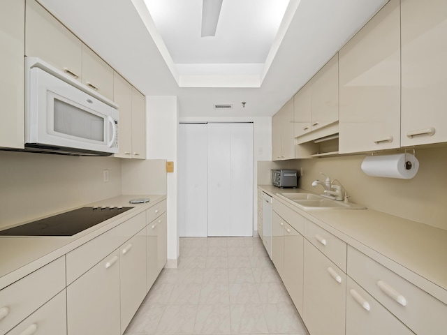 kitchen with sink and white appliances