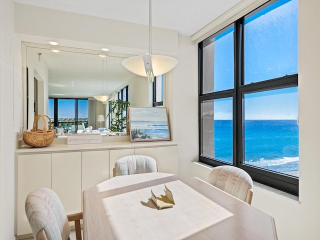 dining area featuring a water view