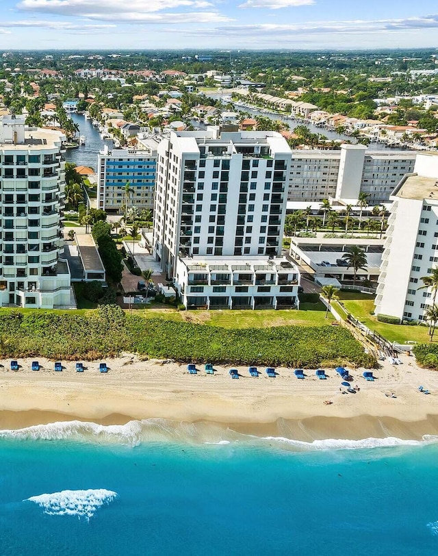 aerial view featuring a water view and a beach view