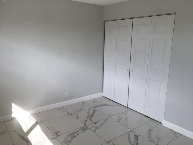 unfurnished bedroom with a closet