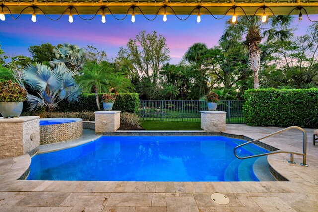 mediterranean / spanish home with stucco siding, a tiled roof, decorative driveway, and a front yard