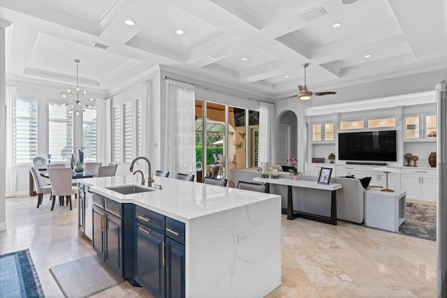 kitchen featuring blue cabinetry, sink, coffered ceiling, decorative light fixtures, and ceiling fan with notable chandelier