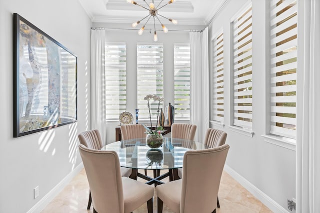 dining space with ornamental molding and an inviting chandelier