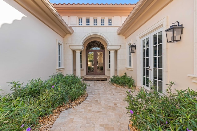 property entrance featuring french doors