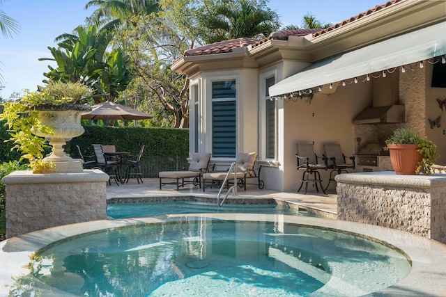 view of swimming pool with a patio area and a hot tub