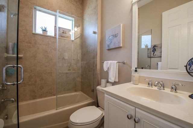 full bathroom with vanity, toilet, and tiled shower / bath