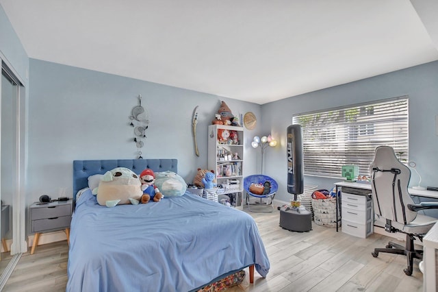 bedroom with light wood-type flooring