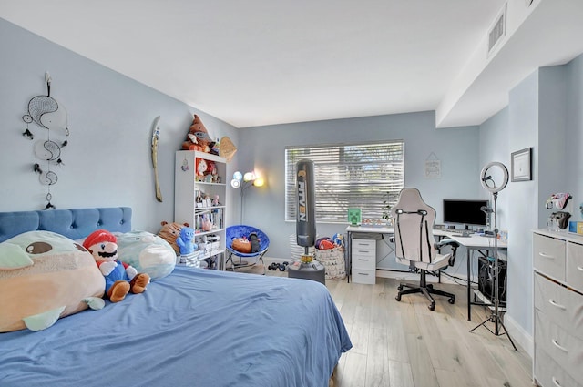 bedroom featuring light wood-type flooring