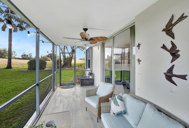 sunroom / solarium with ceiling fan